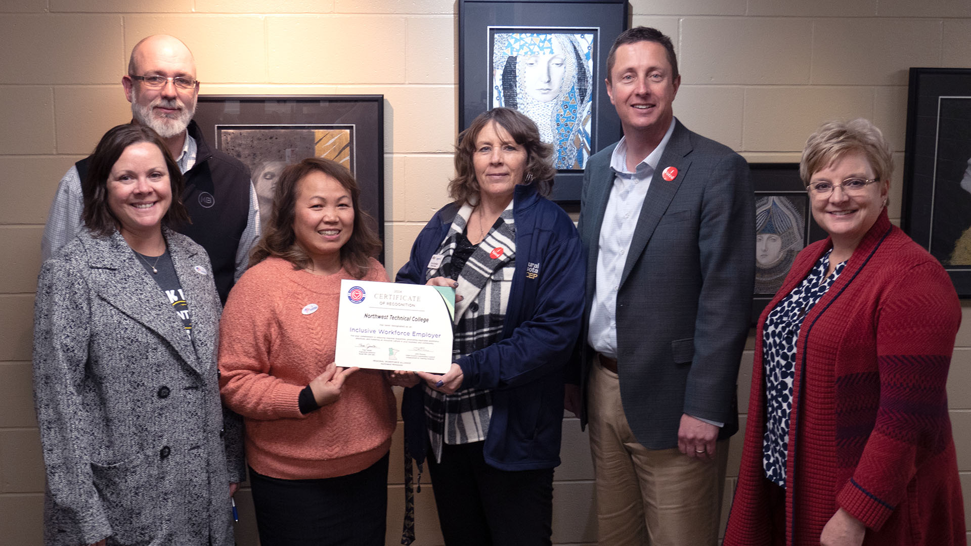 MNCEP representatives presenting a plaque to four administrators from NTC