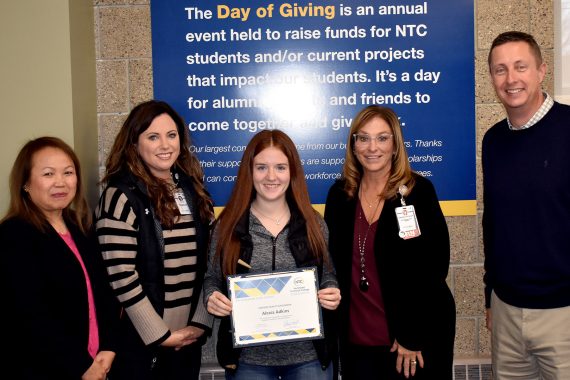 NTC student Alexa Adkins poses with representatives from Sanford Health and NTC vice president Ketmani Kouanchao and NTC president John L. Hoffman