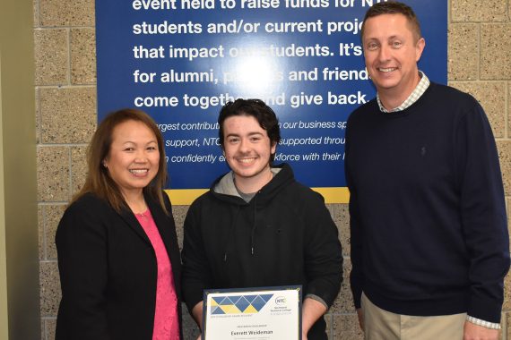 NTC student Everett Weideman NTC vice president Ketmani Kouanchao and NTC president John L. Hoffman