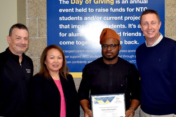 NTC student Joshua Olorunyemi poses with representatives from Paul Bunyan Communications and NTC vice president Ketmani Kouanchao and NTC president John L. Hoffman