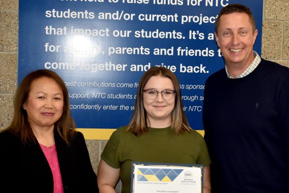 NTC student Lilee Bock poses with NTC vice president Ketmani Kouanchao and NTC president John L. Hoffman