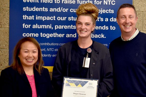 NTC student Megan Hevaron NTC vice president Ketmani Kouanchao and NTC president John L. Hoffman