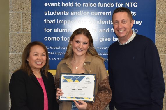 NTC student Nichole Dennis NTC vice president Ketmani Kouanchao and NTC president John L. Hoffman